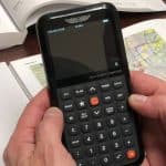 A pilot holding an ASA flight computer