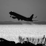 Hierarchy of Commercial Pilots: From Captain to Second Officer A commercial plane shortly after taking off. Photo in black and white