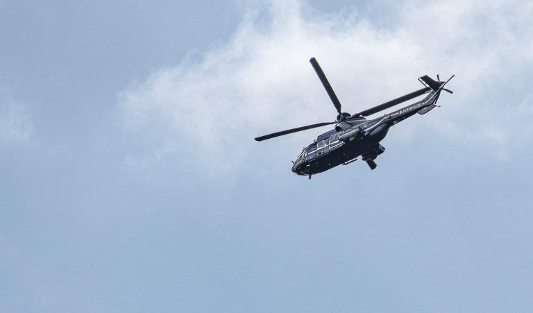 A Police helicopter flying quickly