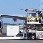A plane being refueled by a man