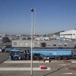 Planes just about to be refueled by a refueling truck