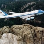 The Story Behind Why Air Force One is Painted Blue Air Force One flying over Mount Rushmore
