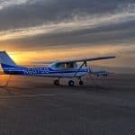 A Cessna plane parked on the runway