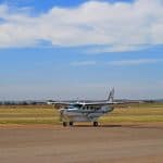 A small plane just about to take off on a runway