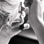A closeup of a flight attendant with a piercing