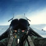 A head-on view of a fighter pilot cruising