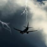 A plane flying in turbulence and lightning