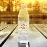 An Evian watter bottle on a table