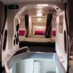 A sleeping compartment on a plane for flight attendants