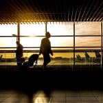 Passengers walking through the terminal to their gate
