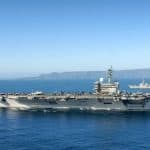 Two aircraft carriers sailing in the ocean