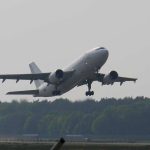 A plane in the sky flying low so has not reached its angle of attack