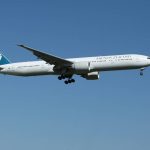 an airplane cruising in blue skies