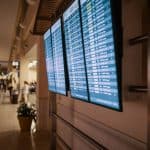 Three private jets parked on a runway