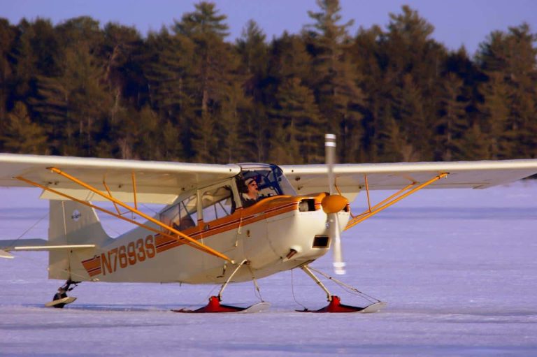A bush plane parked on an icy field