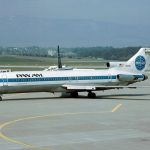 A Pan Am plane parked on a runway