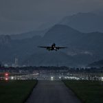 A red eye flight plane approaching to land