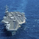 An American aircraft carrier sailing in the ocean