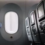 An airplane window in a Boeing plane