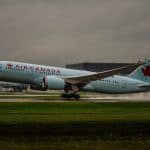 An Air Canada plane taking off from the runway